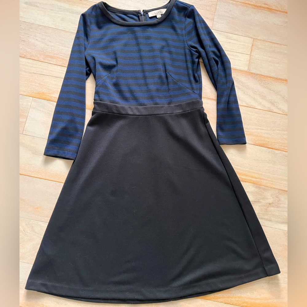 3 quarter length sleeve, knee length dress. Machine washable